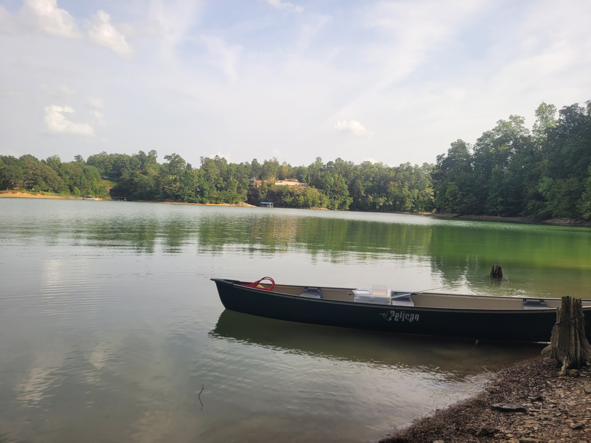A canoe resting at the shore of the Highland Shores lake