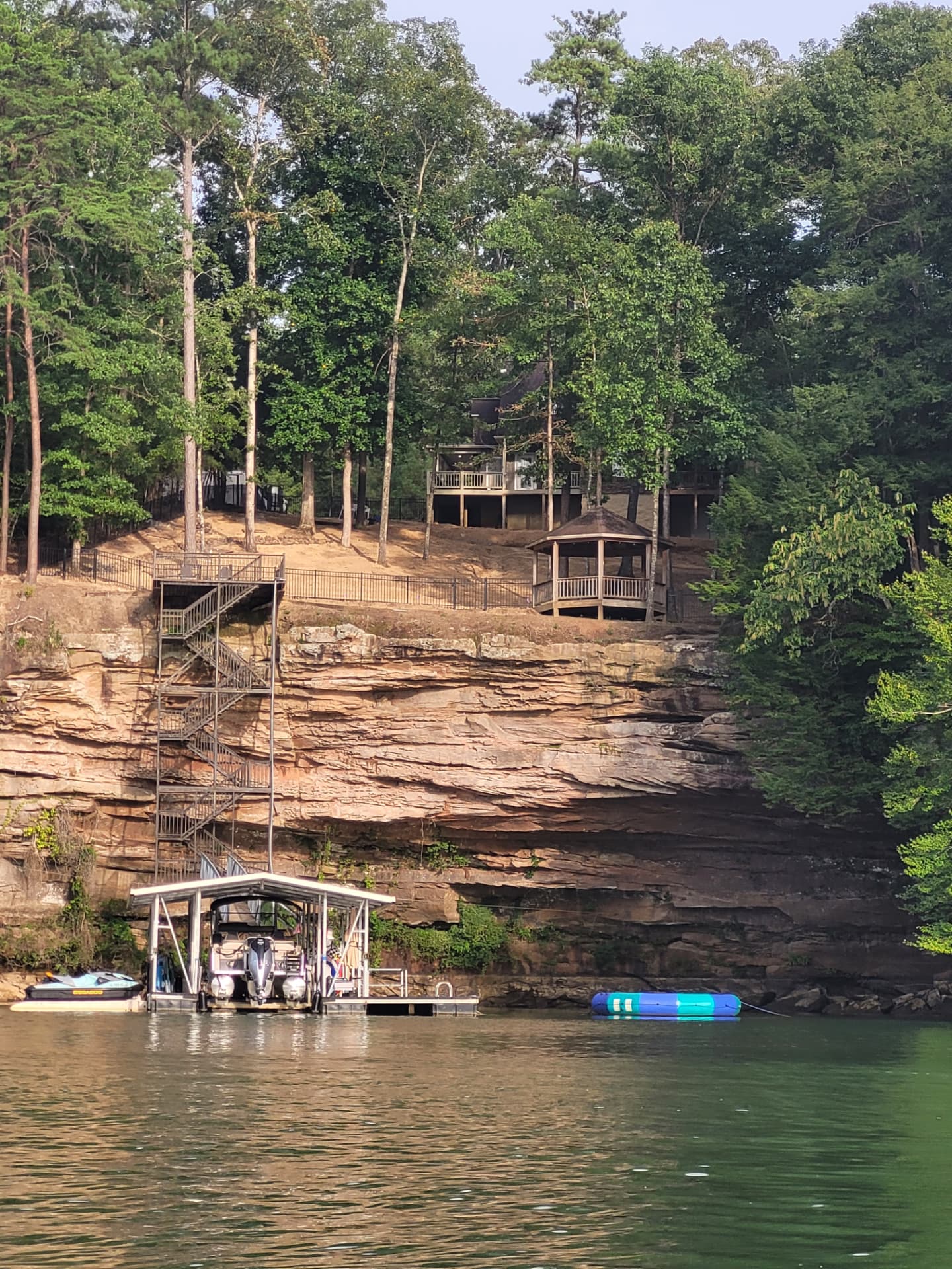 Cliffside boat dock with spiral staircase at Highland Shores